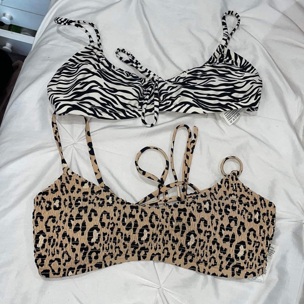Two Hollister bikini tops, top is zebra print and the bottom is cheetah